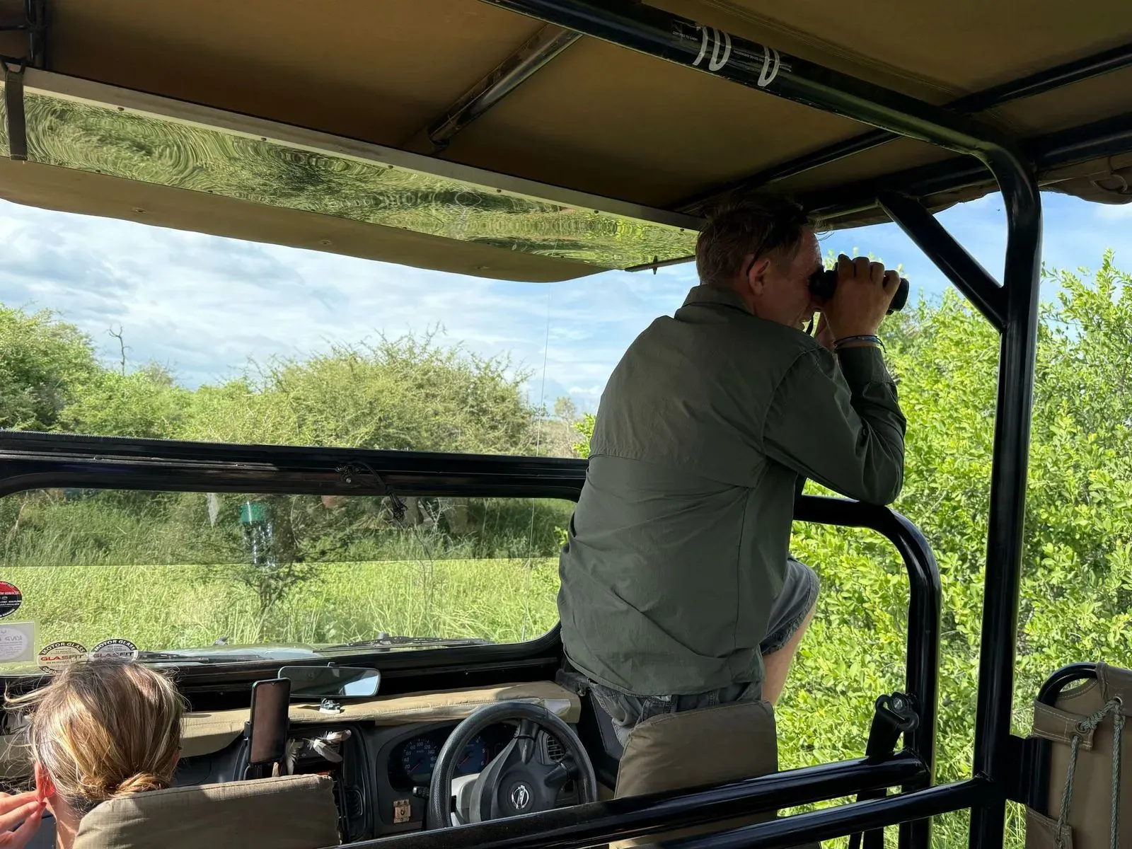 Jacob scouting for game from the vehicle